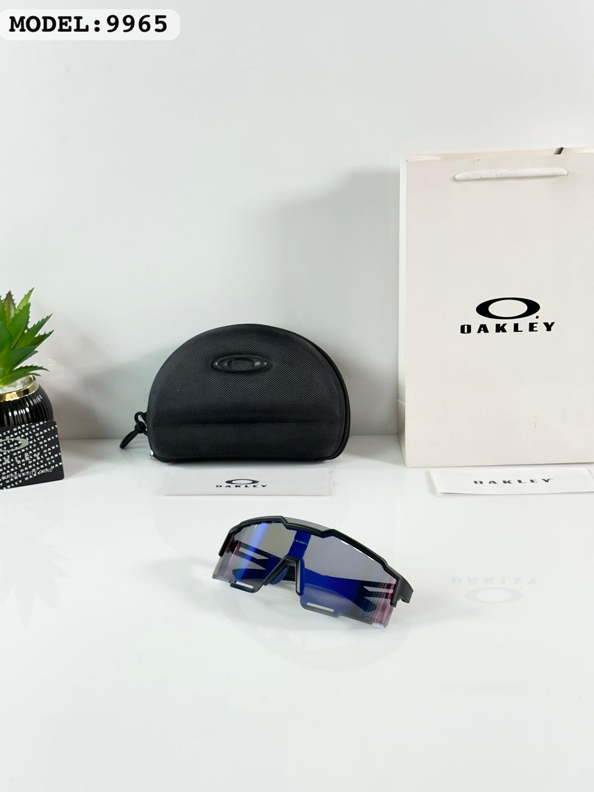 Oakley 9965 Black/Blue Reva