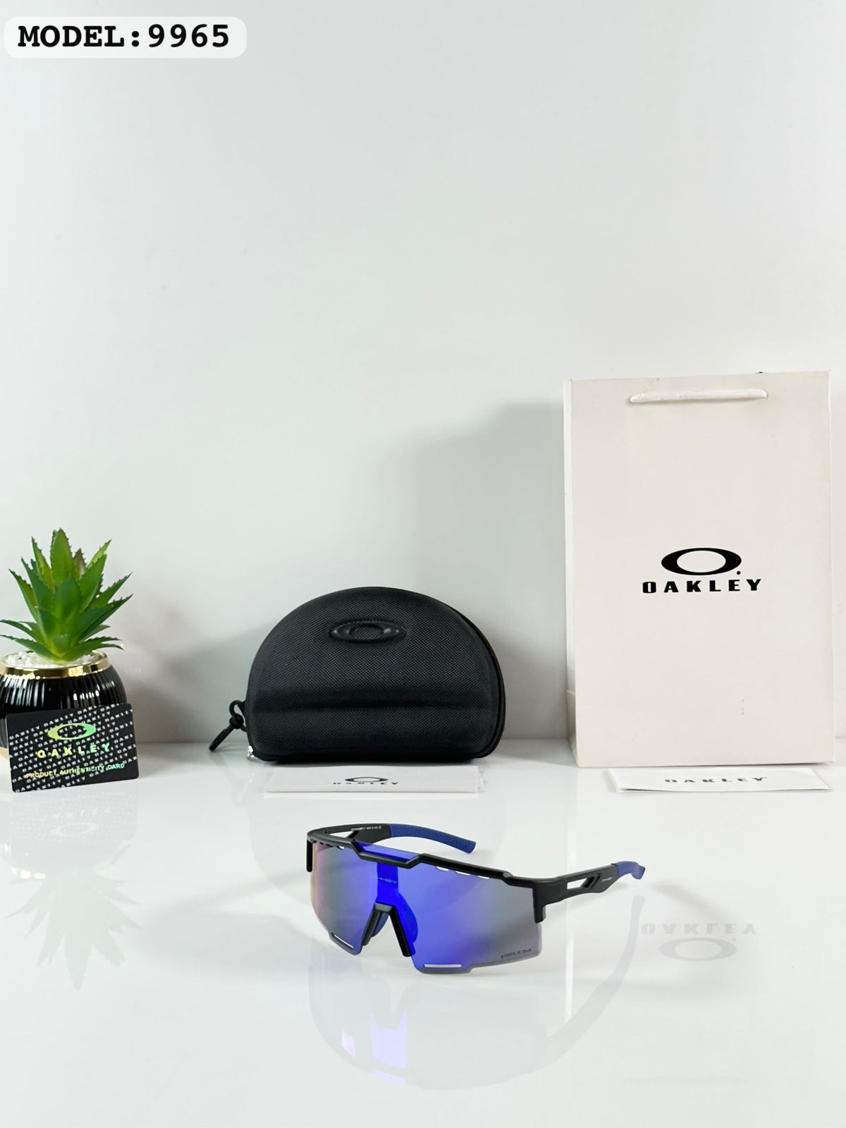 Oakley 9965 Black/Blue Reva
